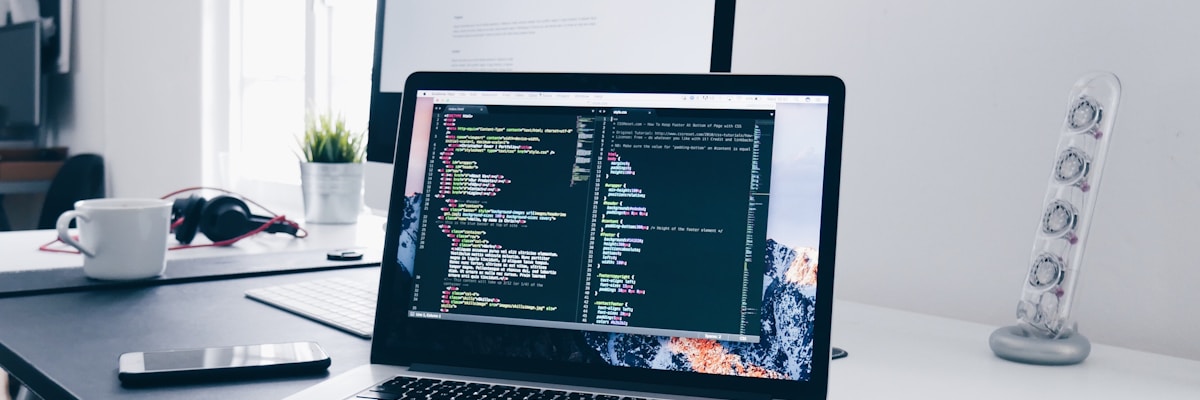 Developer building digital systems and solutions on a laptop